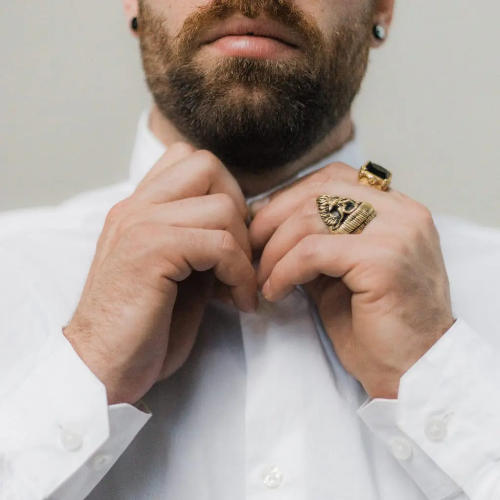 man in white dress shirt buttoning up 3214788 scaled