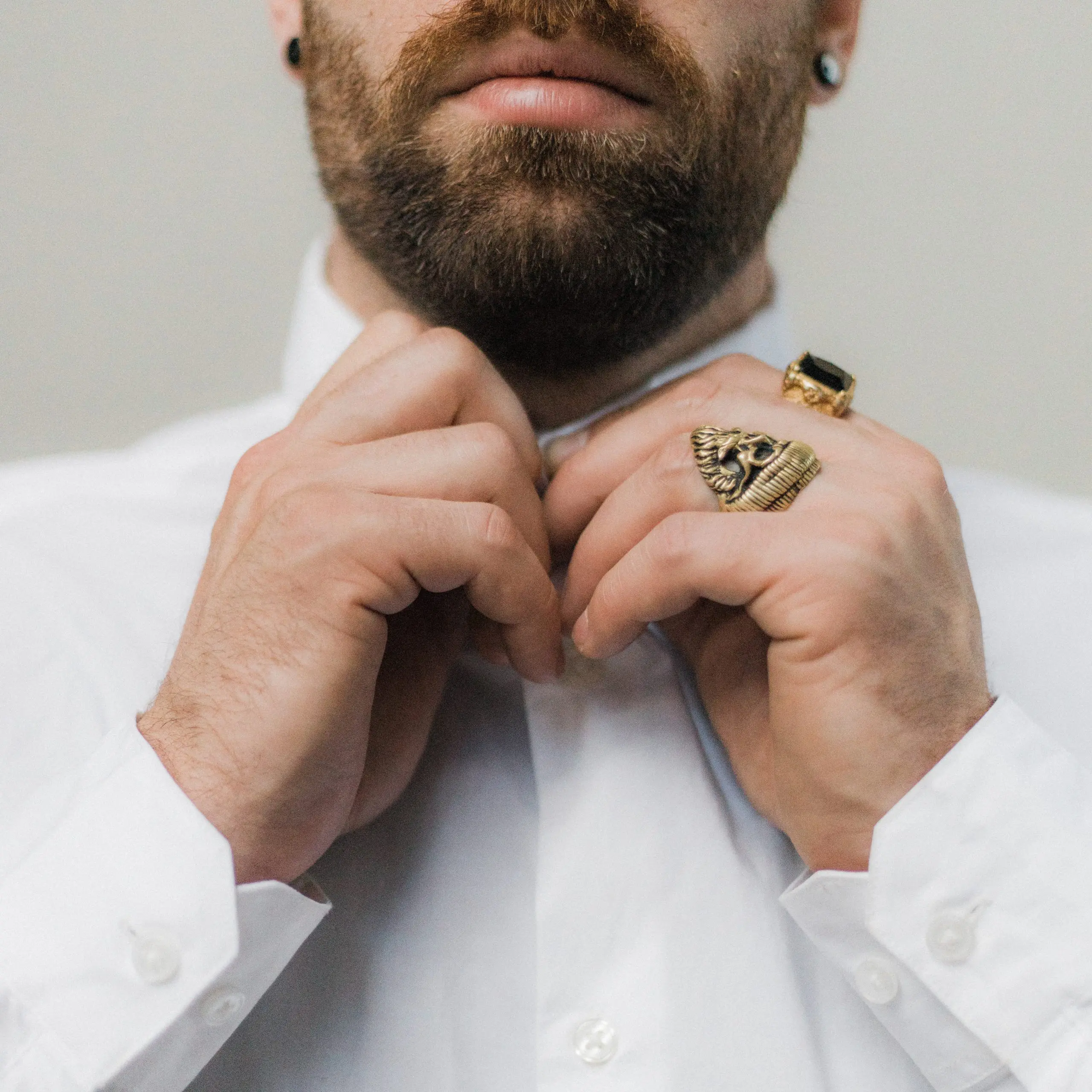man in white dress shirt buttoning up 3214788 scaled