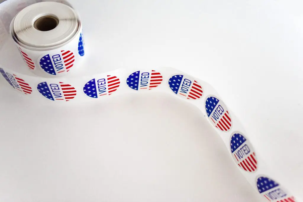 i voted sticker spool on white surface 1550336 scaled