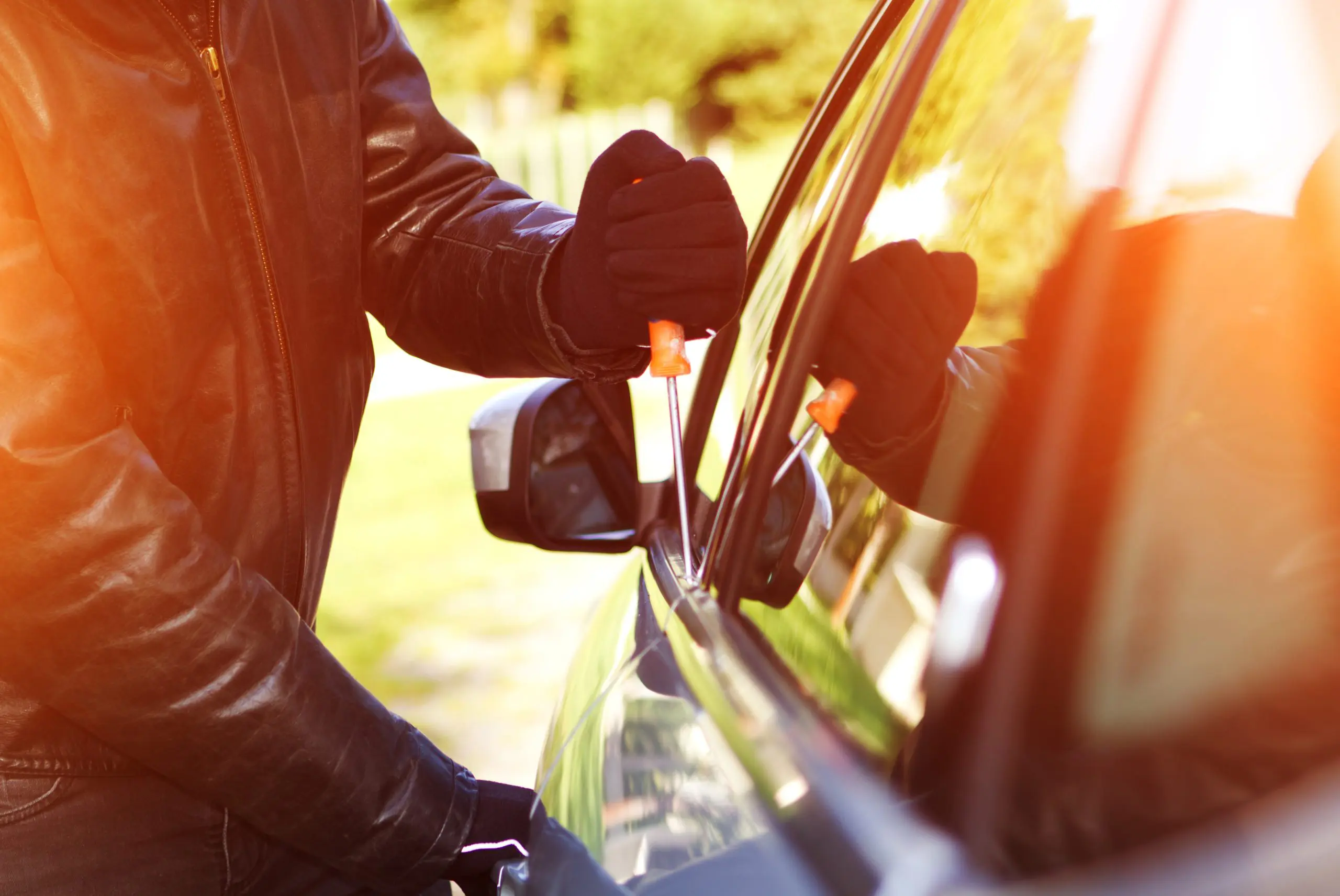 Thief stealing a car