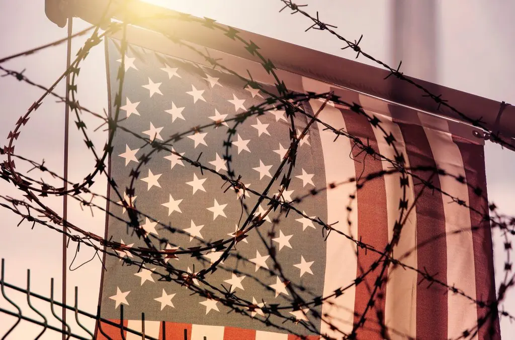 American flag and barbed wire, USA border