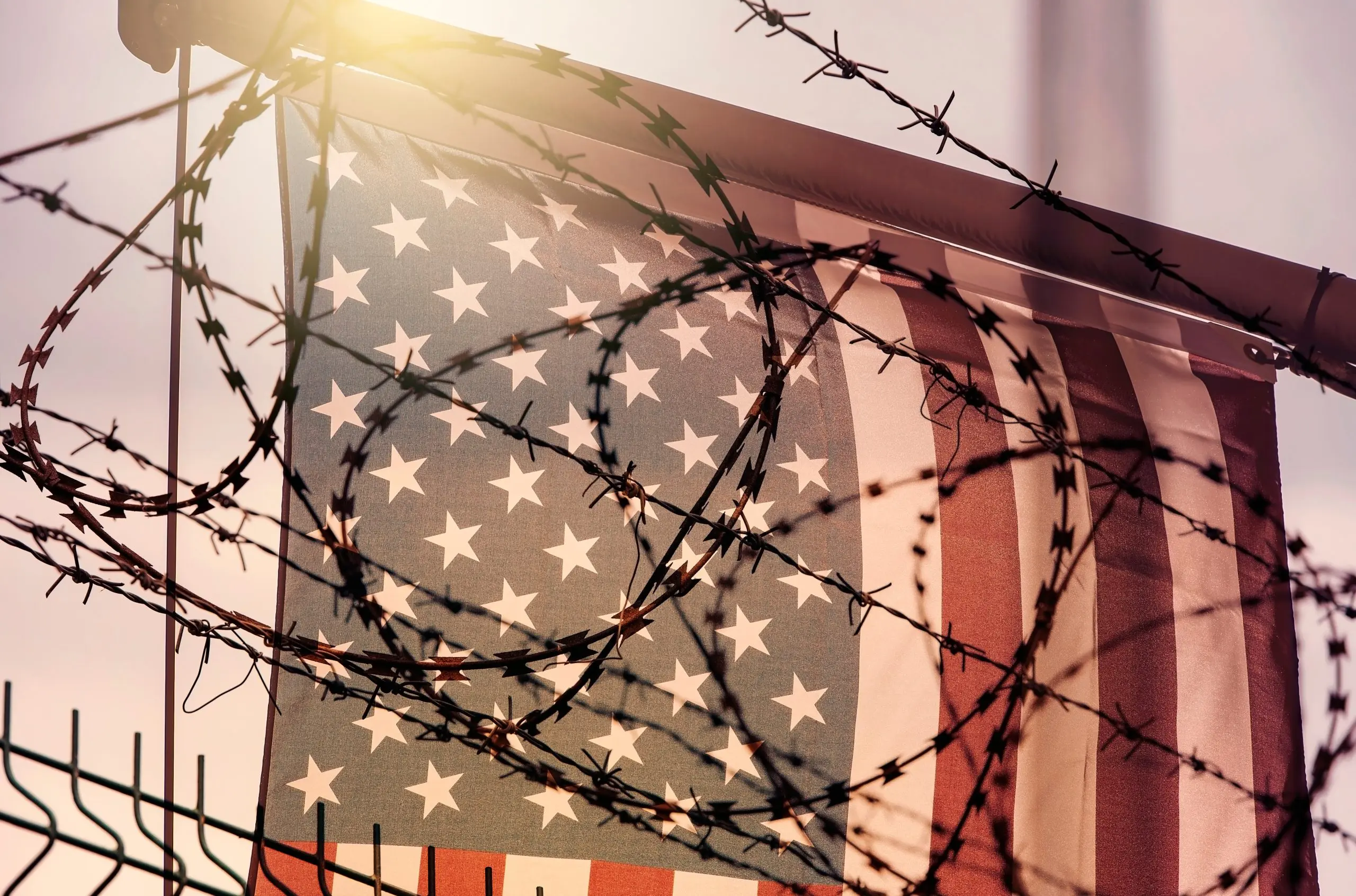 American flag and barbed wire, USA border