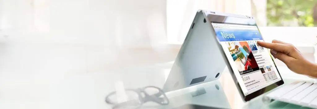 Reading News Website Or Electronic Newspaper
