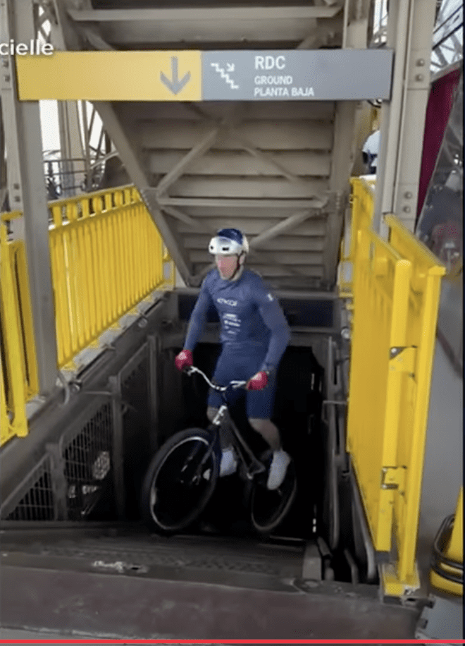 Cyclist bikes up Eiffel Tower