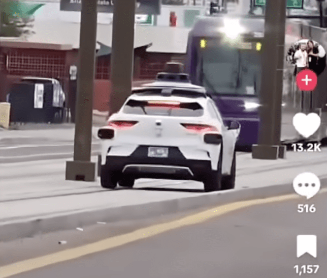 Waymo car drives on train tracks
