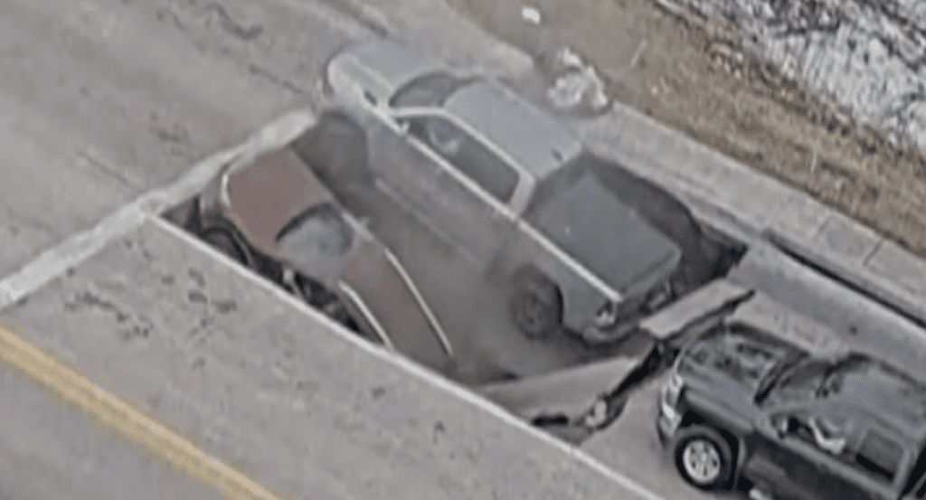 Cars sucked into sinkhole