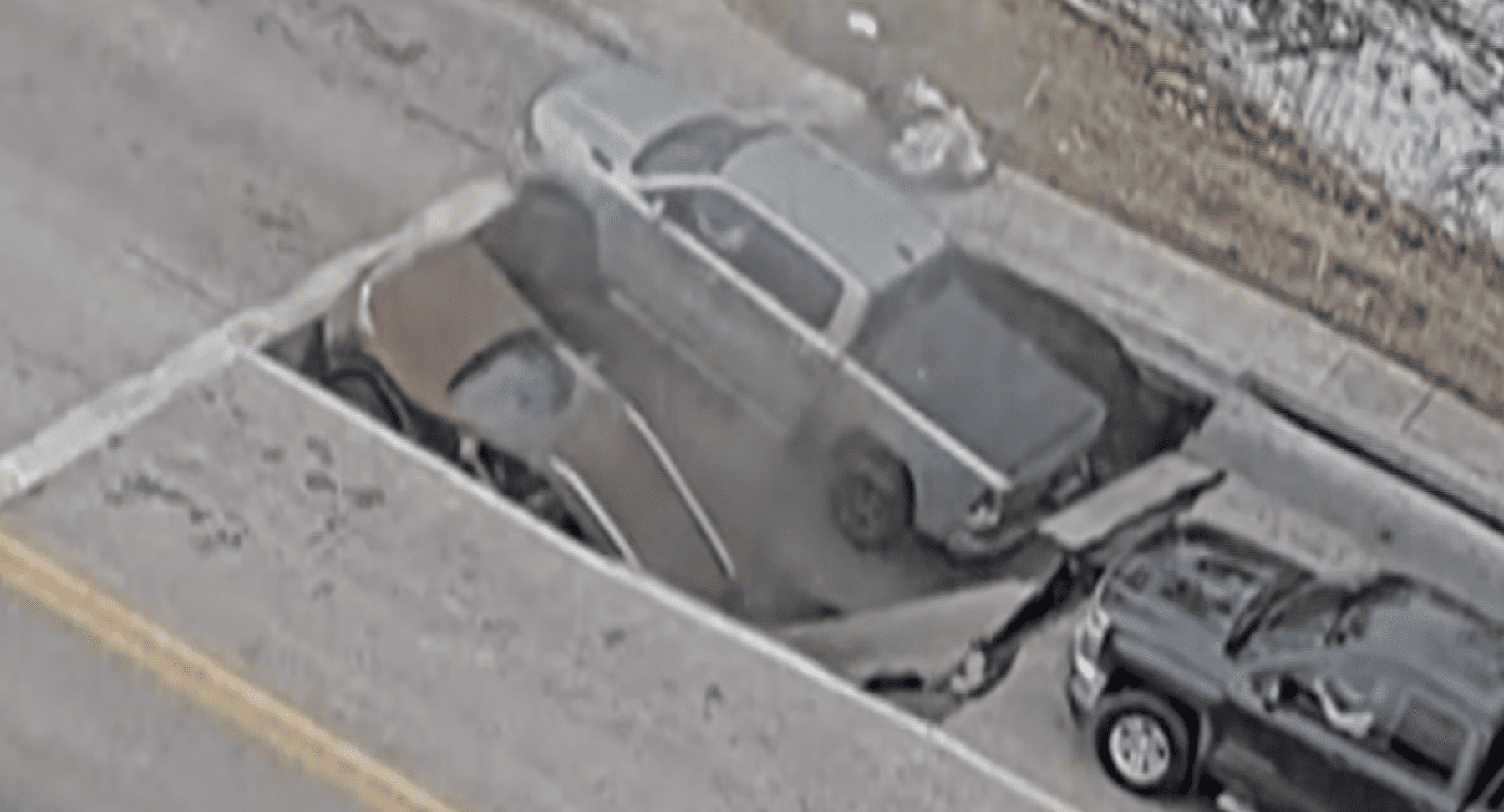 Cars sucked into sinkhole