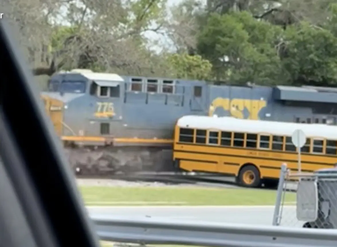School bus driver arrested after driving bus onto train tracks