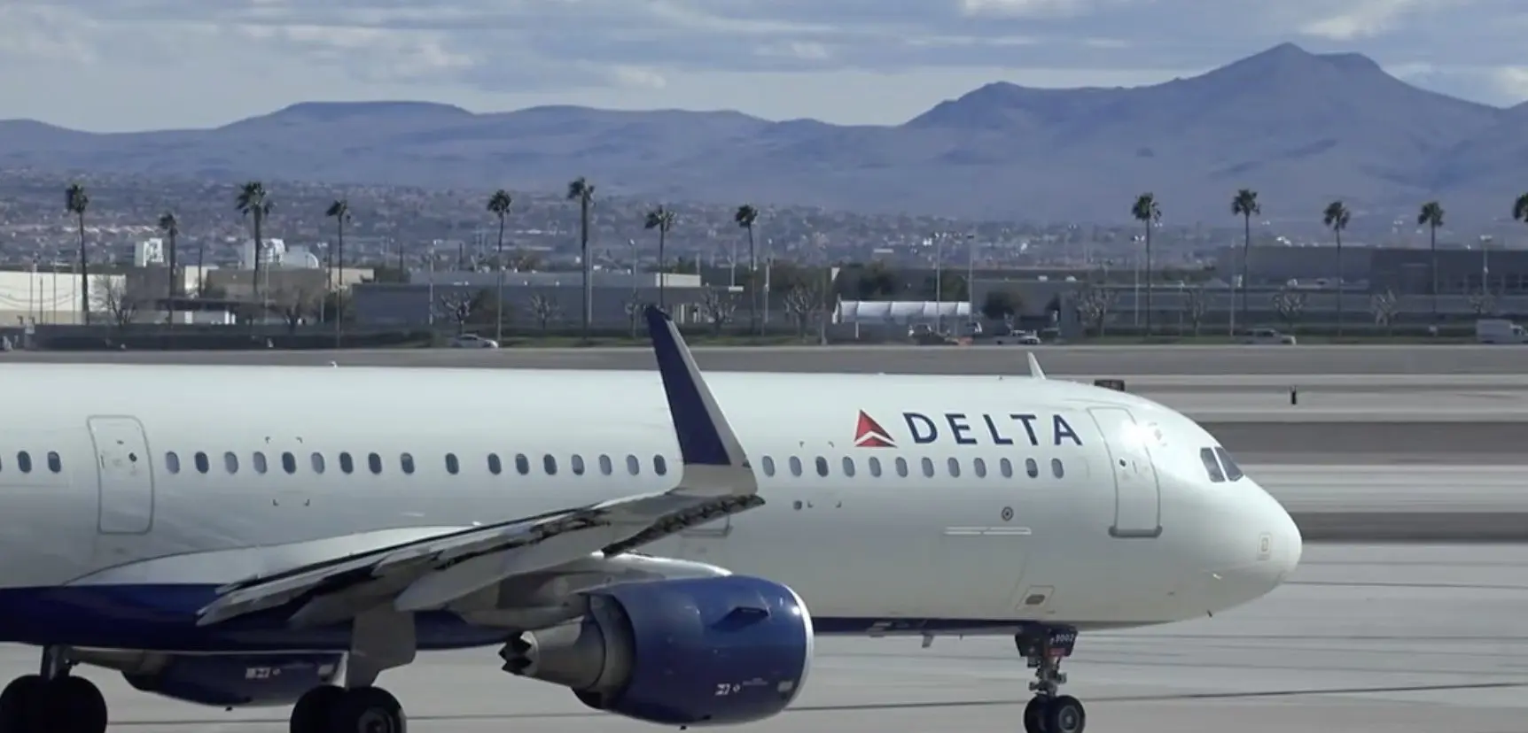 Delta cutting complimentary snacks and drinks