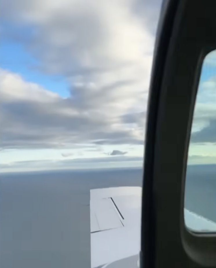 Plane door blows open mid-flight