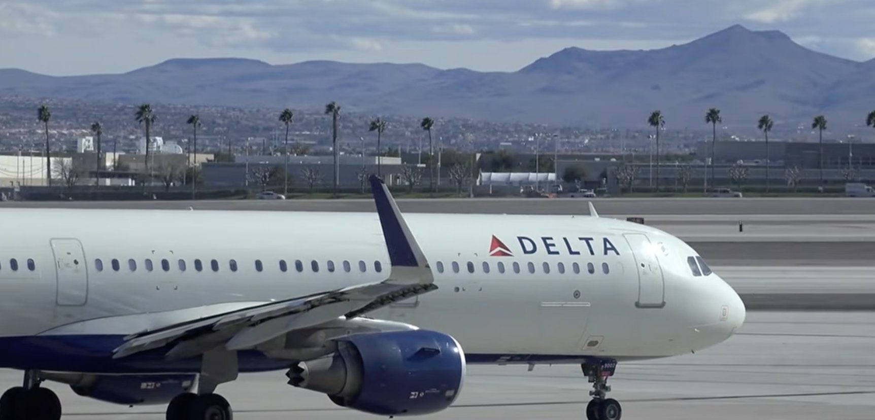 Delta cutting complimentary snacks and drinks